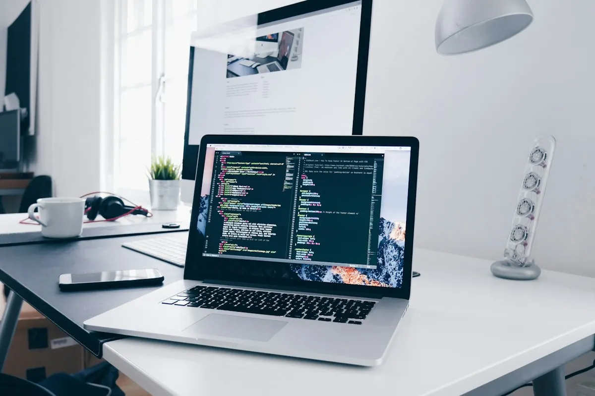Laptop displaying website development code